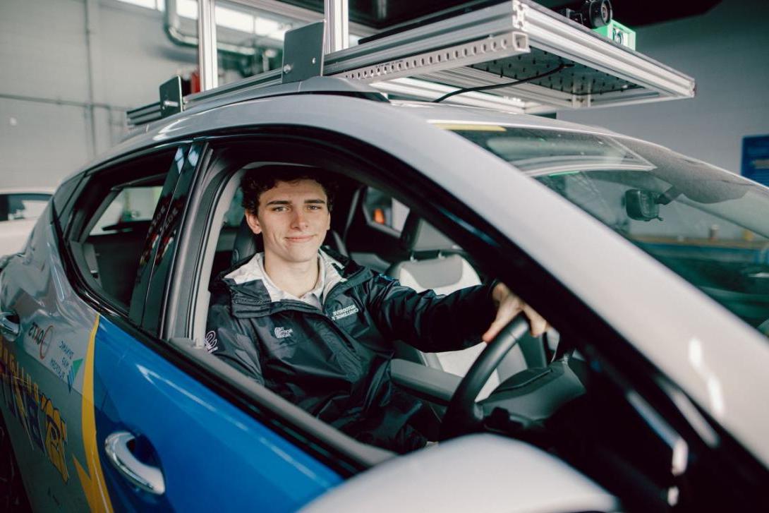 A Kettering student sits in a test vehicle outfitted with cameras and sensors